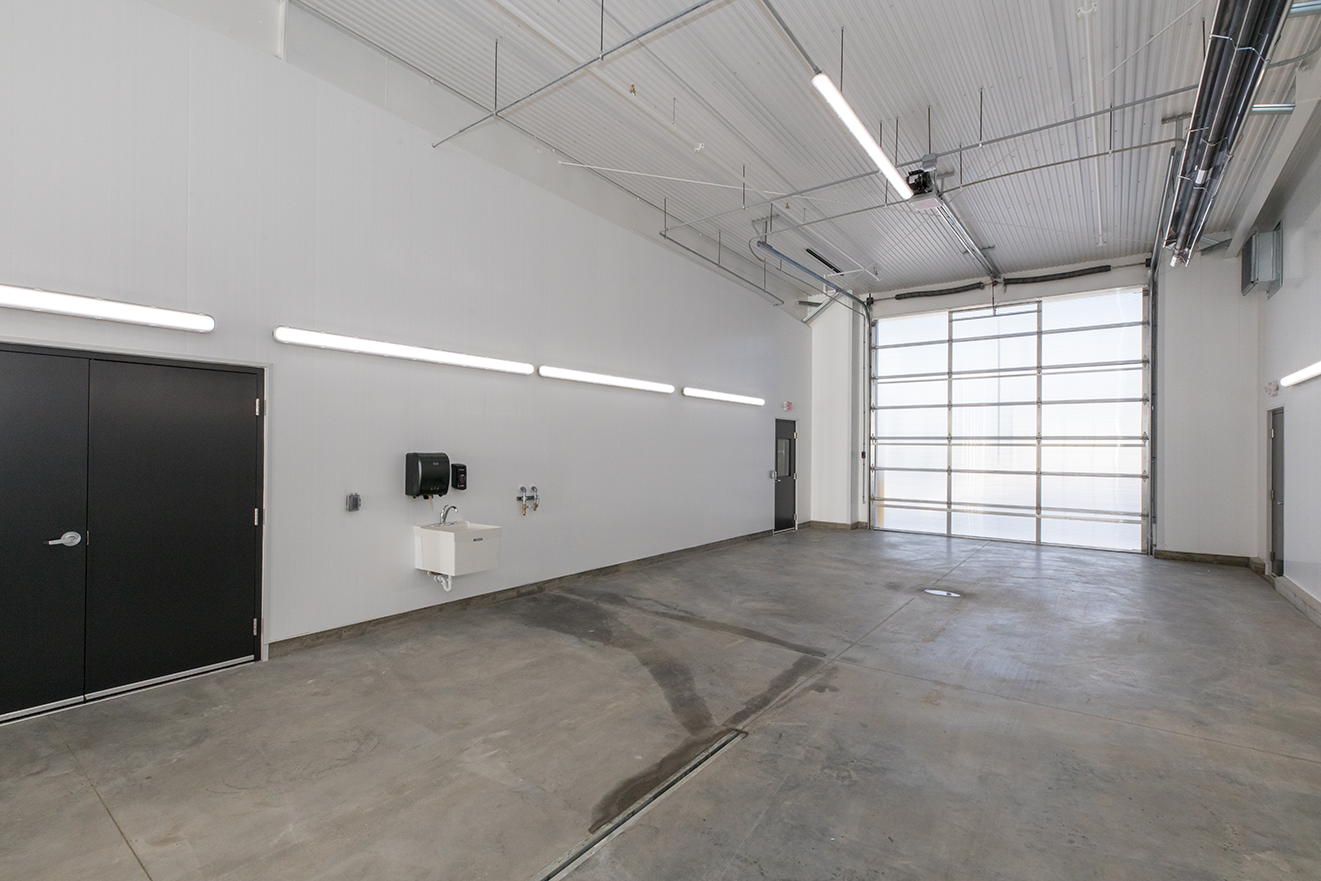 Interior of transportation facility showing bus service wash bay, constructed by Rice Companies
