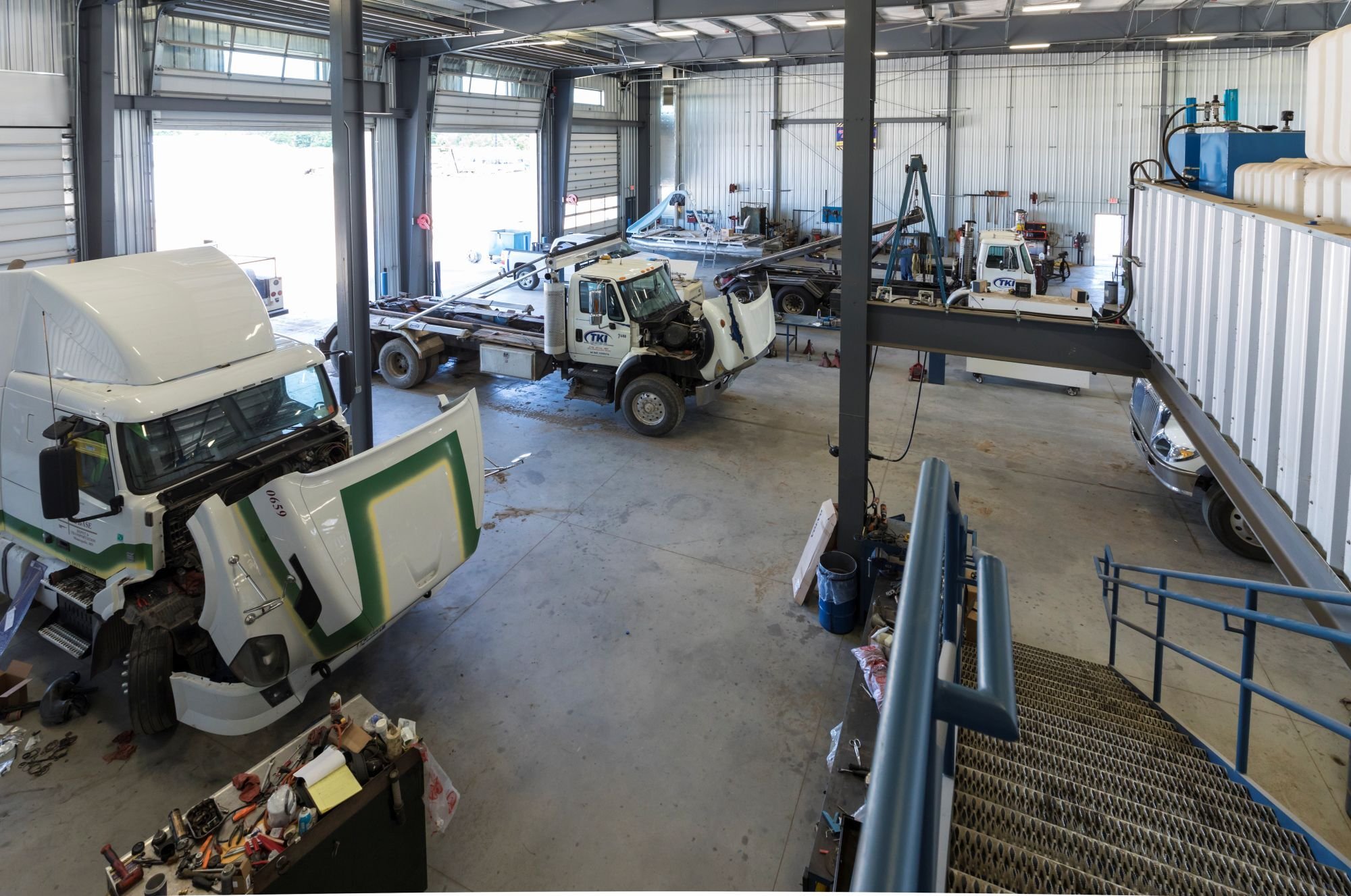 Interior of service facility showing high-bay equipment maintenance area, constructed by Rice Companies
