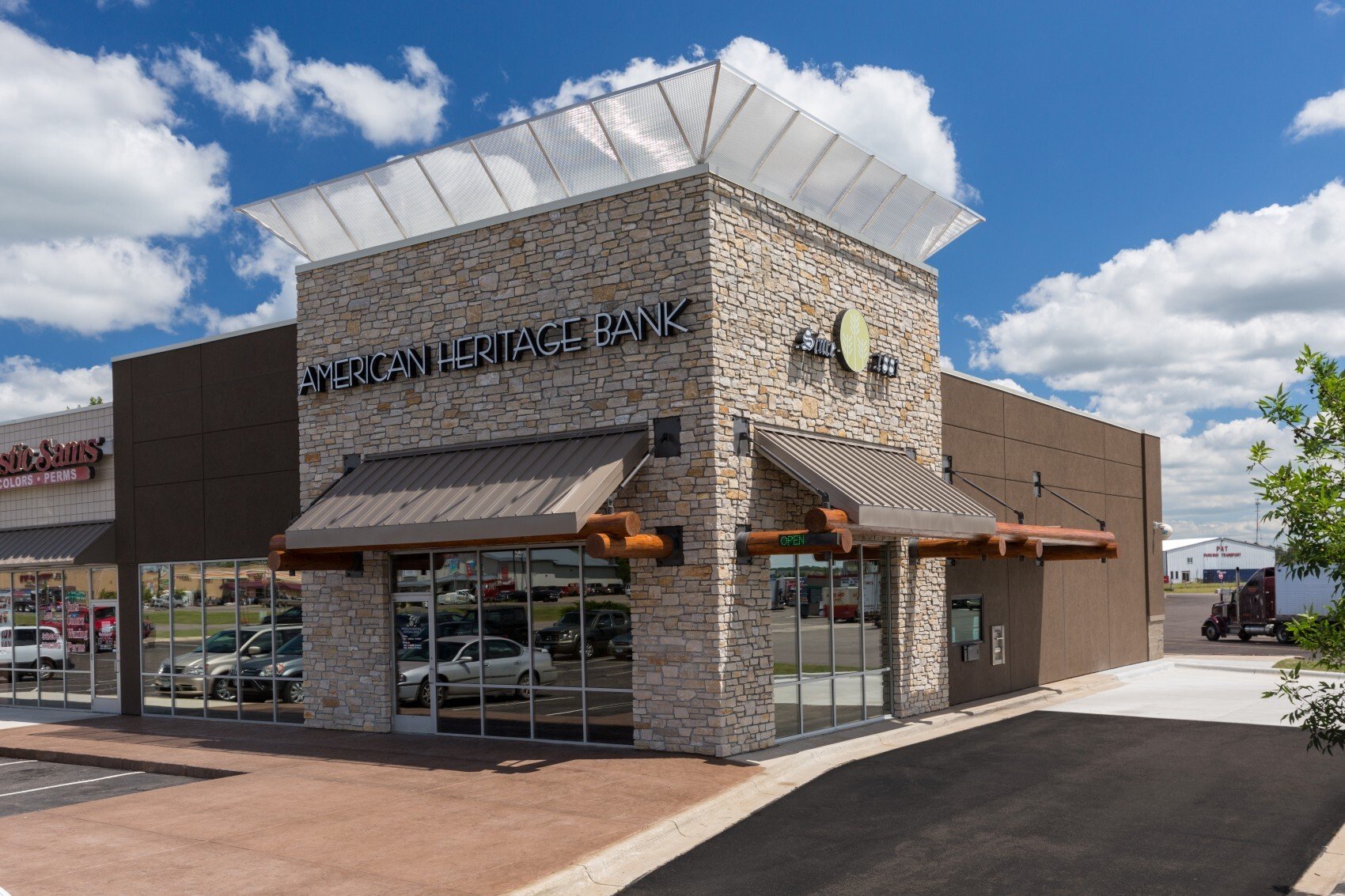 Exterior of retail bank branch showing storefront facade and site access, constructed by Rice Companies