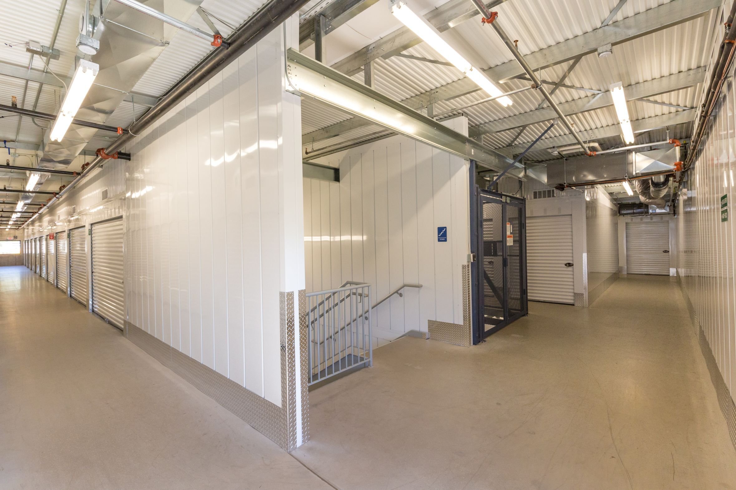 Interior storage corridor at Lakes Region Storage with insulated partitions and secured unit entrances, constructed by Rice Companies.