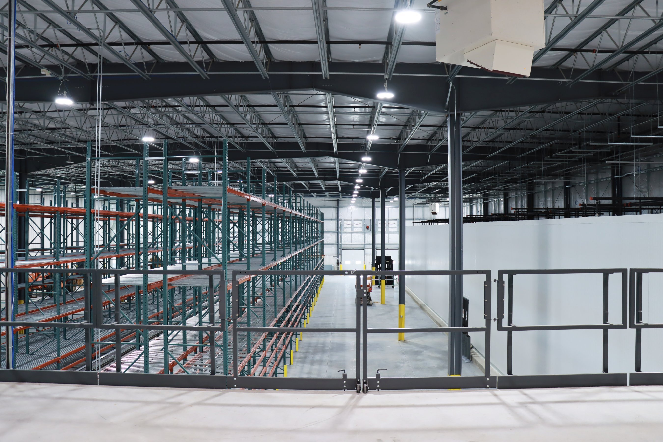 Interior mezzanine view of warehouse racking systems at Bernick’s Vending facility, constructed by Rice Companies.