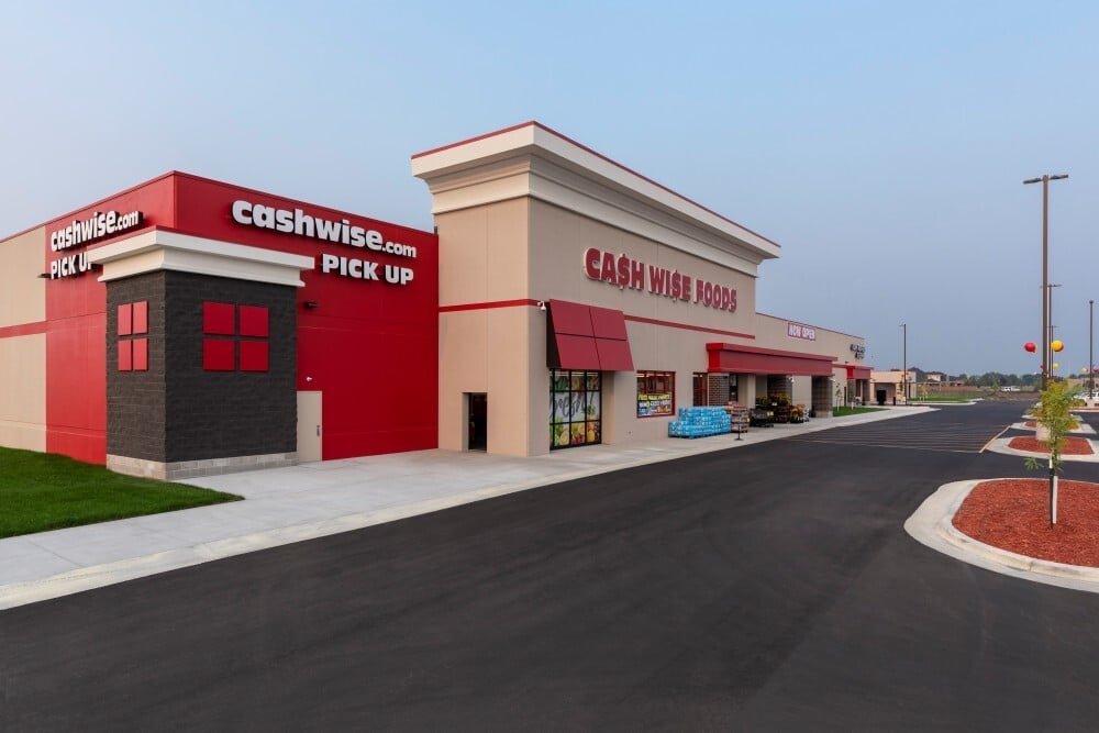 Exterior of Cash Wise Foods grocery store with pickup area and main entrance
