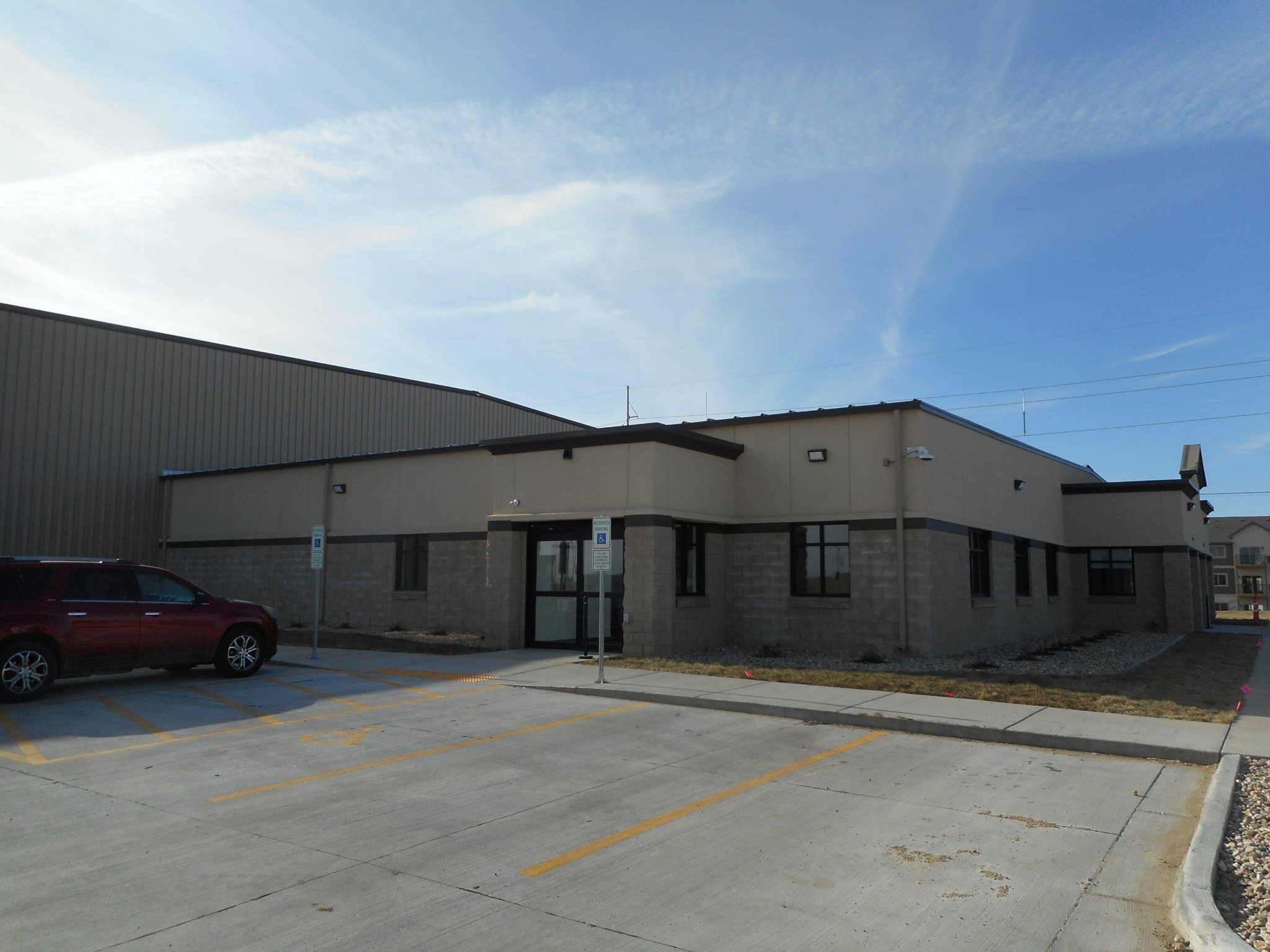 Exterior office entrance and front parking area at the Border States facility, constructed by Rice Companies.