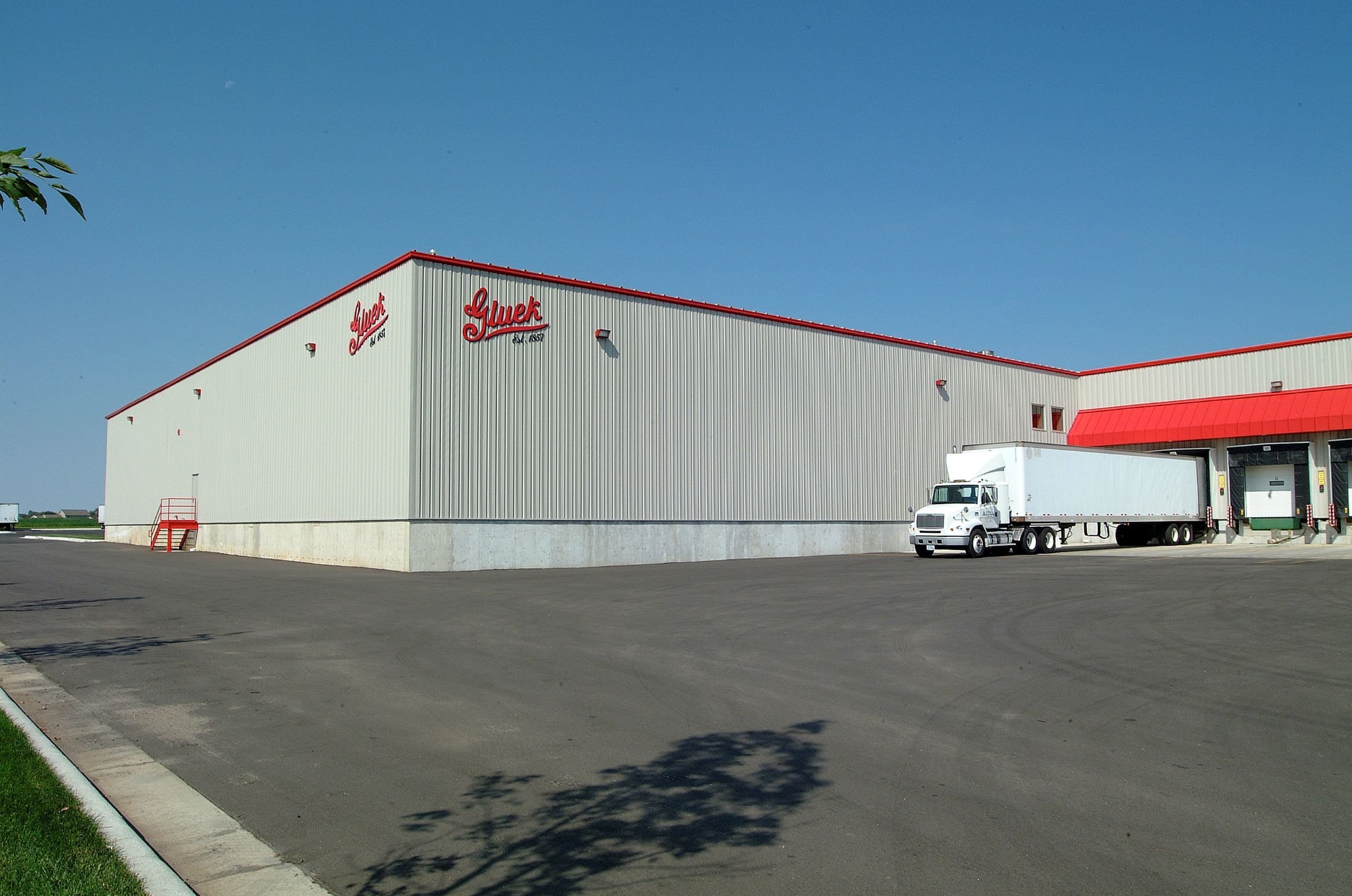 Truck loading docks at Gluek warehouse facility constructed by Rice Companies with multiple dock doors and drive-in access.