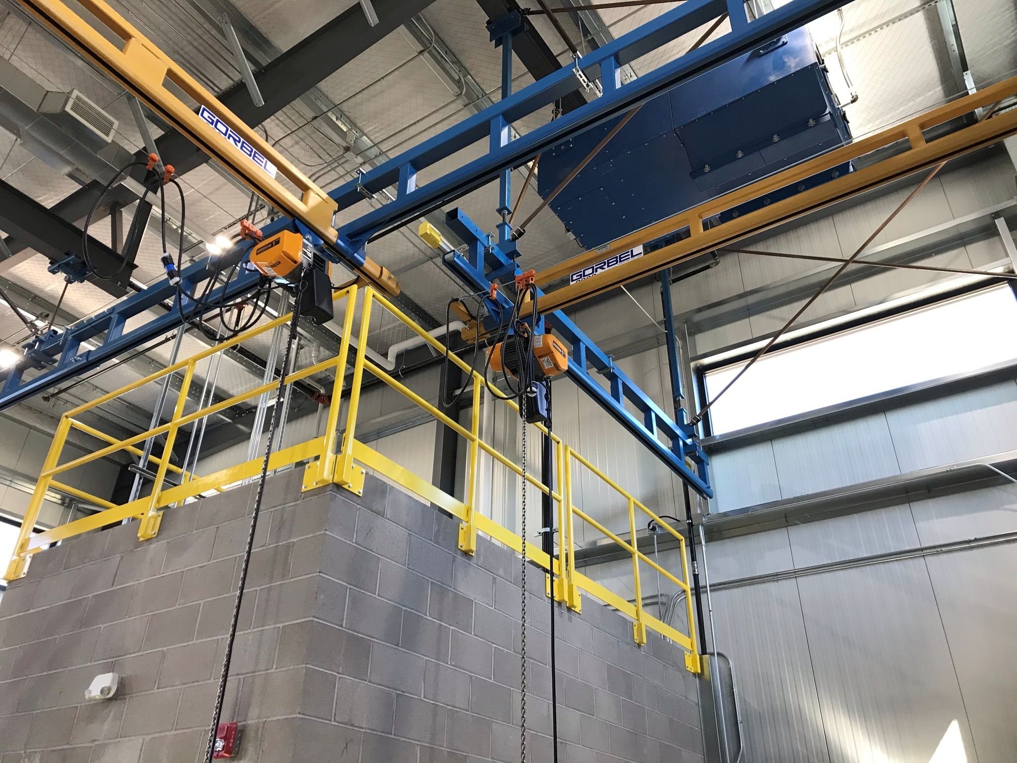 Interior manufacturing space with overhead crane system at Virnig Manufacturing, constructed by Rice Companies.
