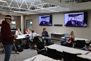 VR intern with headset, screen visible — FEATURED IMAGE