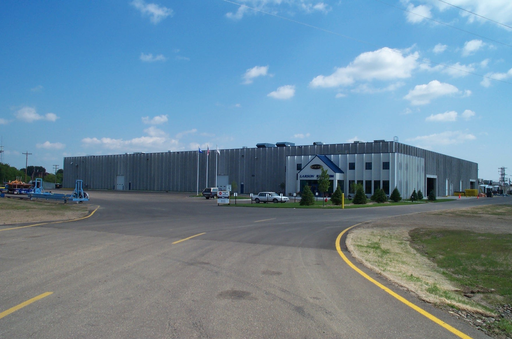 Exterior of manufacturing facility showing production building and site access, constructed by Rice Companies
