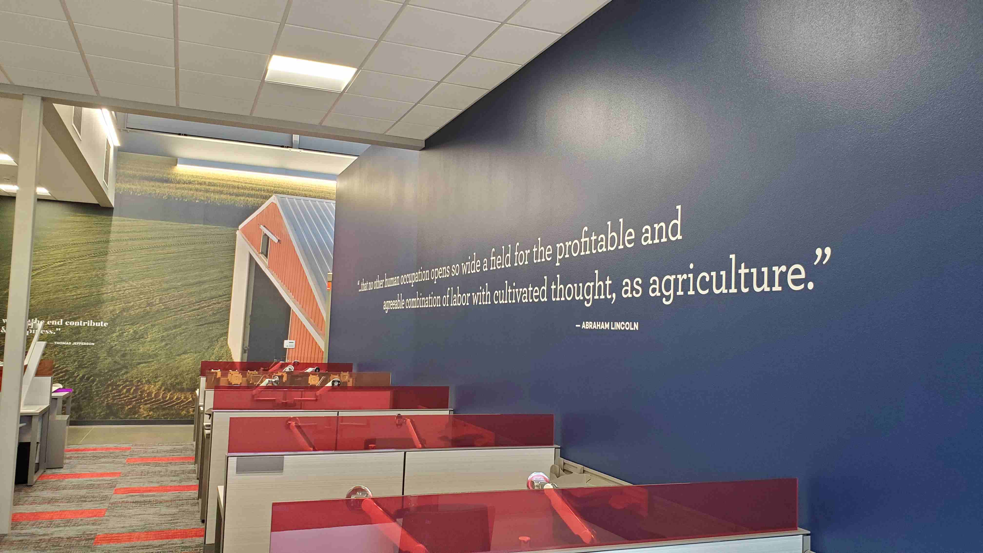 Interior of Rabo AgriFinance office with customized workspace and branded wall graphics, constructed by Rice Companies