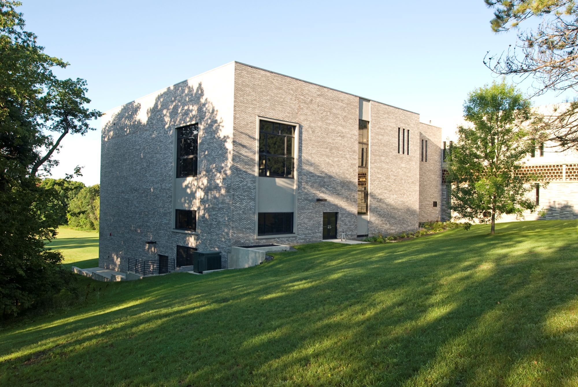 Exterior of academic building showing brick walls and multi-story design, constructed by Rice Companies