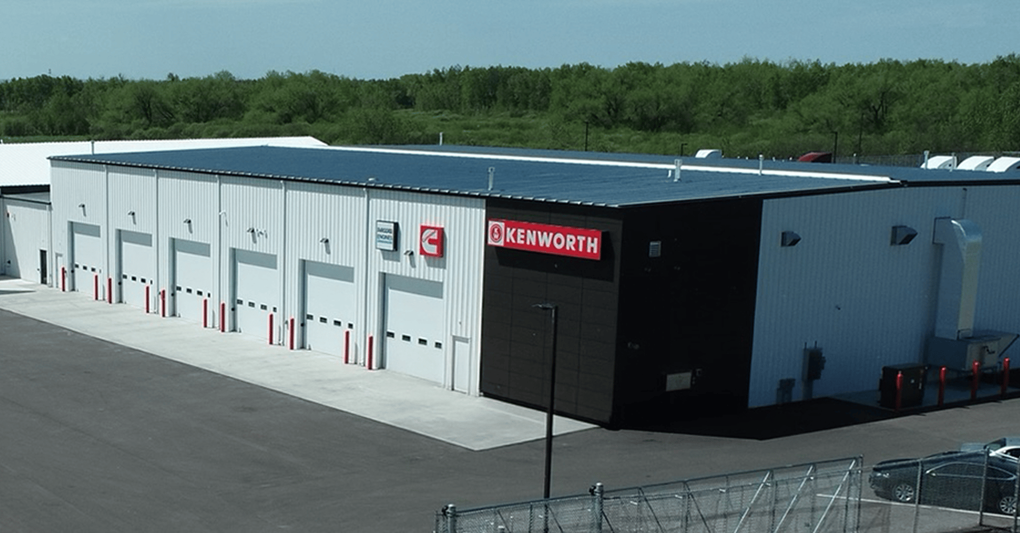 kenworth-truck-dealership-exterior-with-service-bays-and-parking-lot