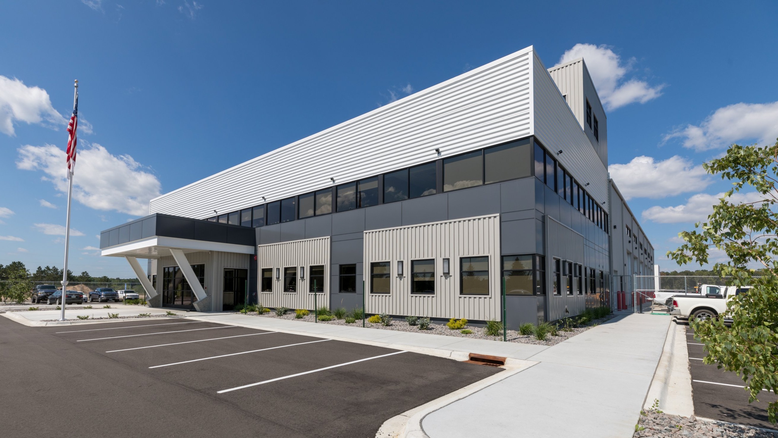 Landwehr Construction headquarters building exterior with modern metal panels and office entry canopy, constructed by Rice Companies.