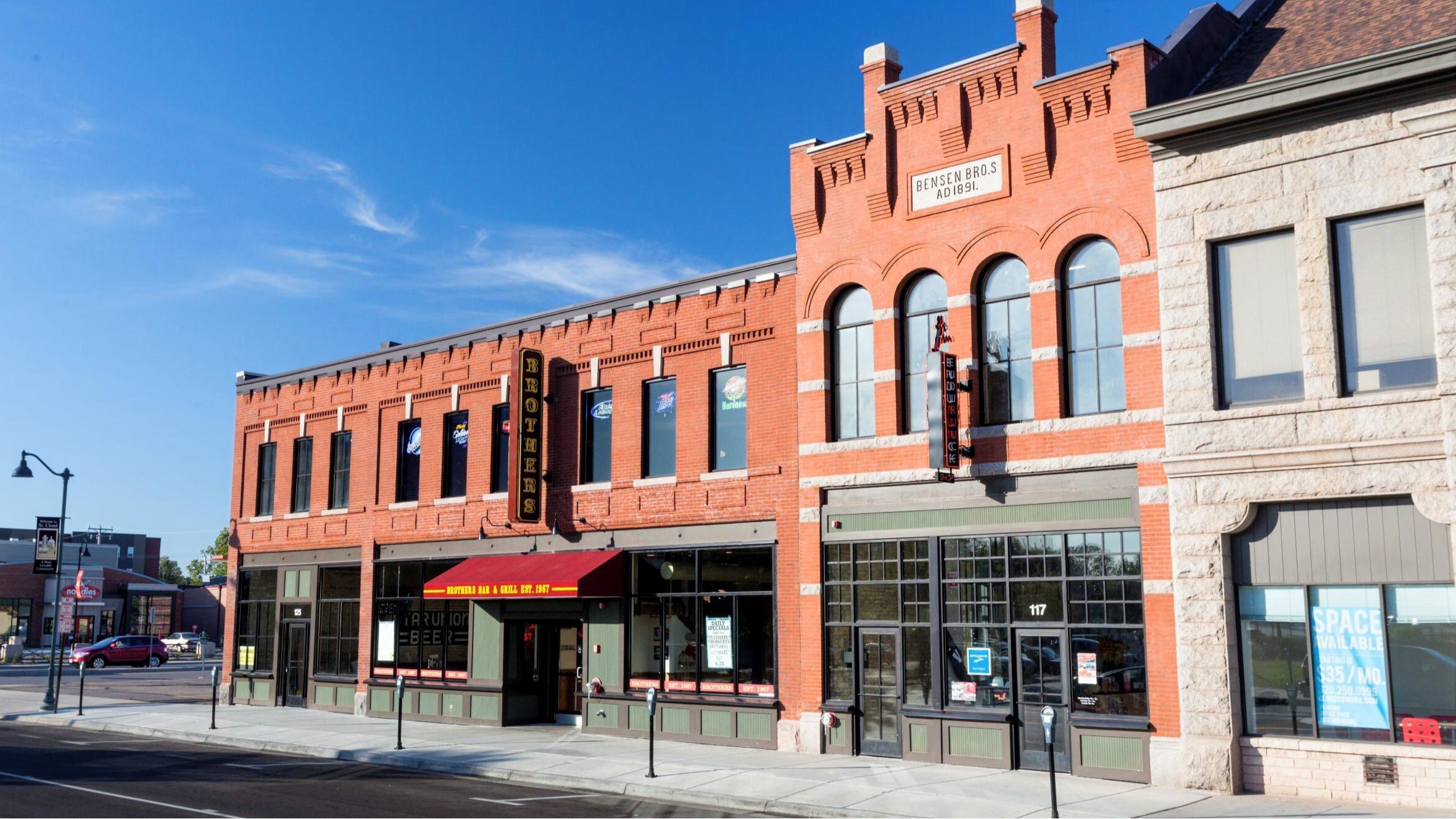 Historic Fifth Avenue Live brick building renovated by Rice Companies in downtown St. Cloud