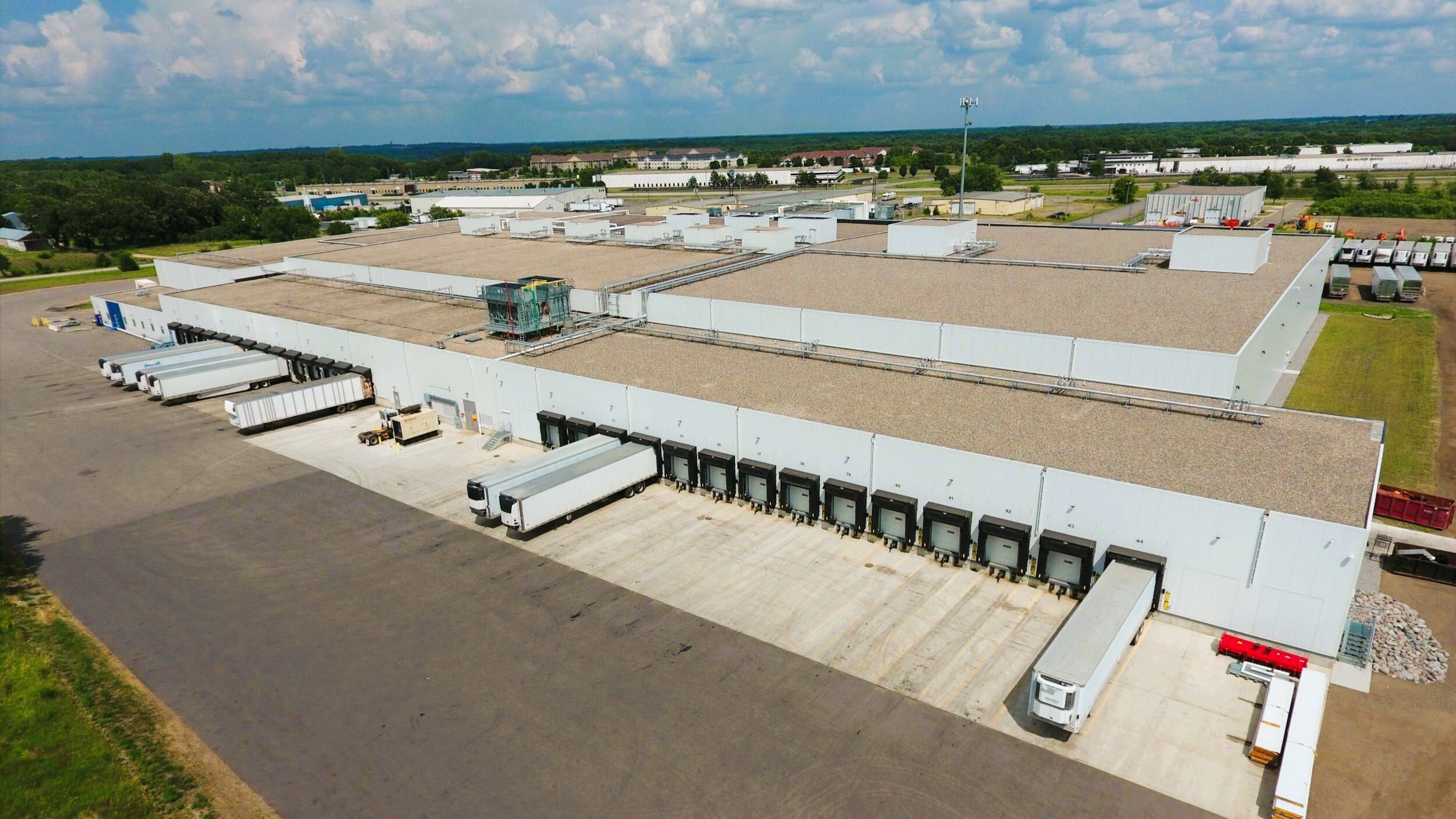 Exterior of cold storage and distribution facility showing loading docks and truck access, constructed by Rice Companies