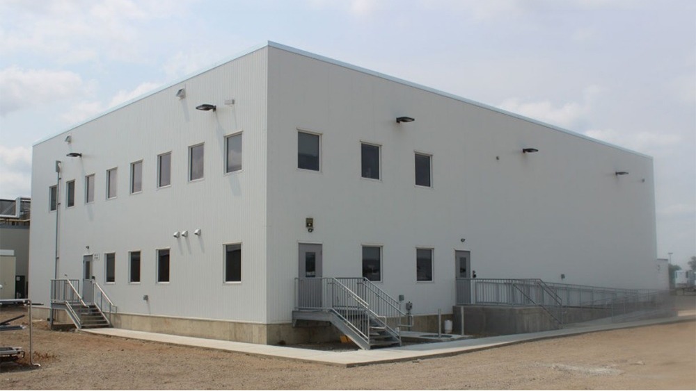 Exterior of food processing facility with metal panel construction and loading docks, constructed by Rice Companies