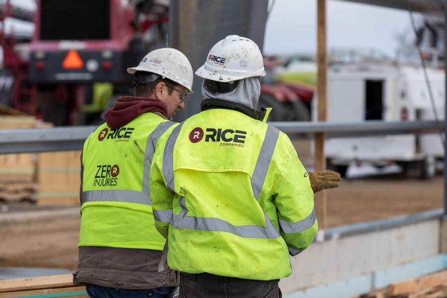 2 workers with high visibility jackets