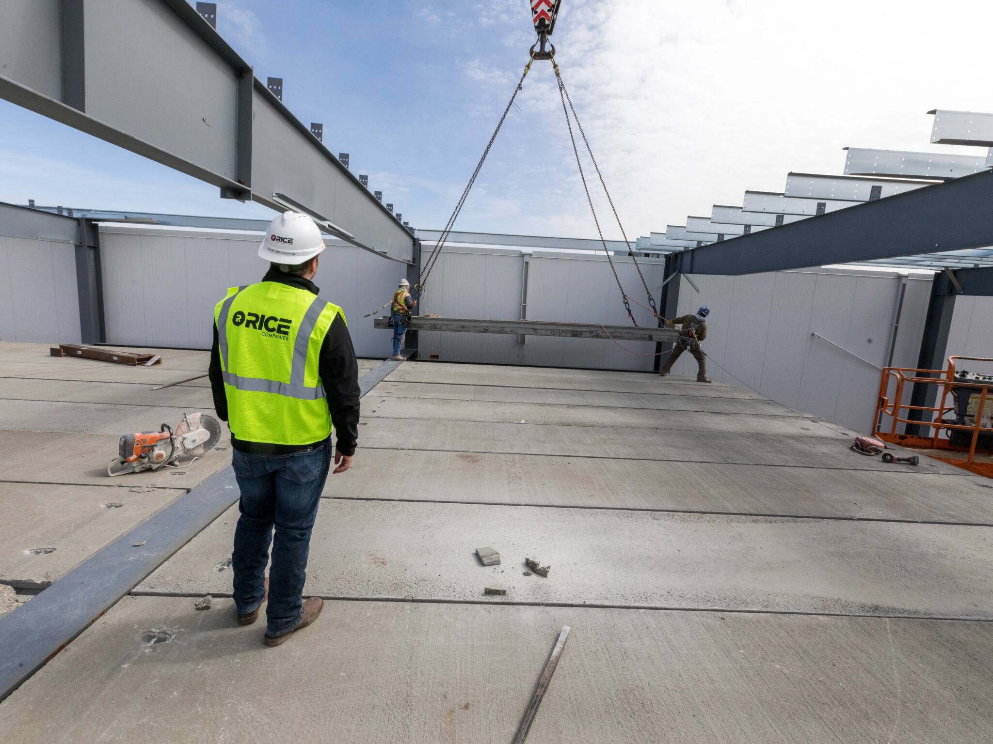 Rice Companies employee overseeing placement of steel beam