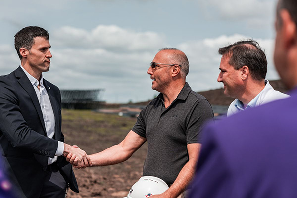 Men shaking hands at ground breaking